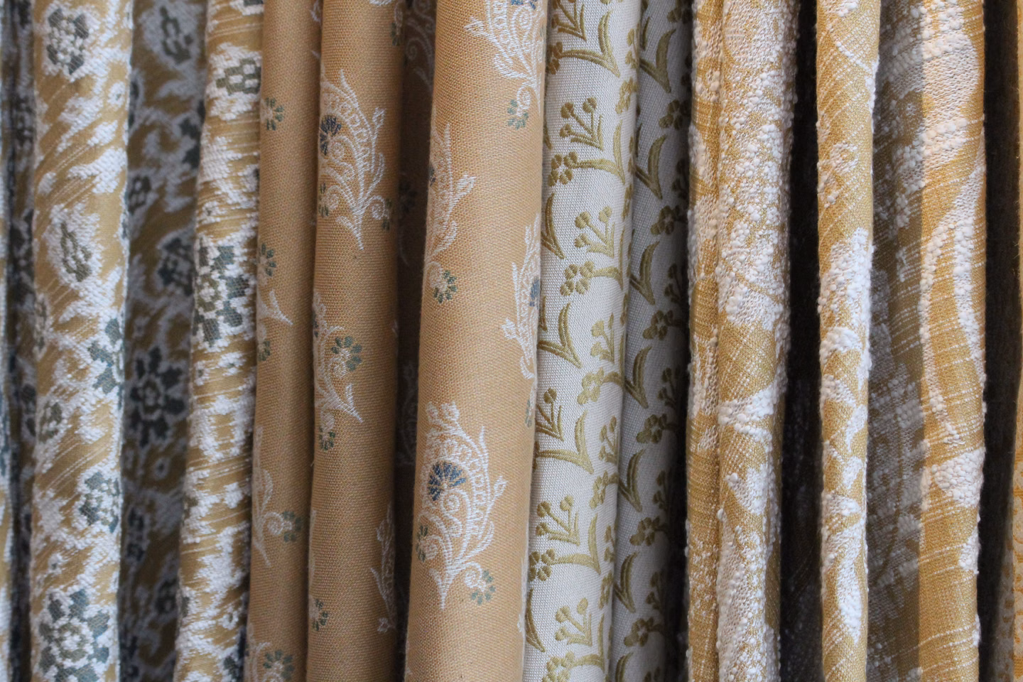 Examples of David Walters Fabrics showing various designs and patterns.
