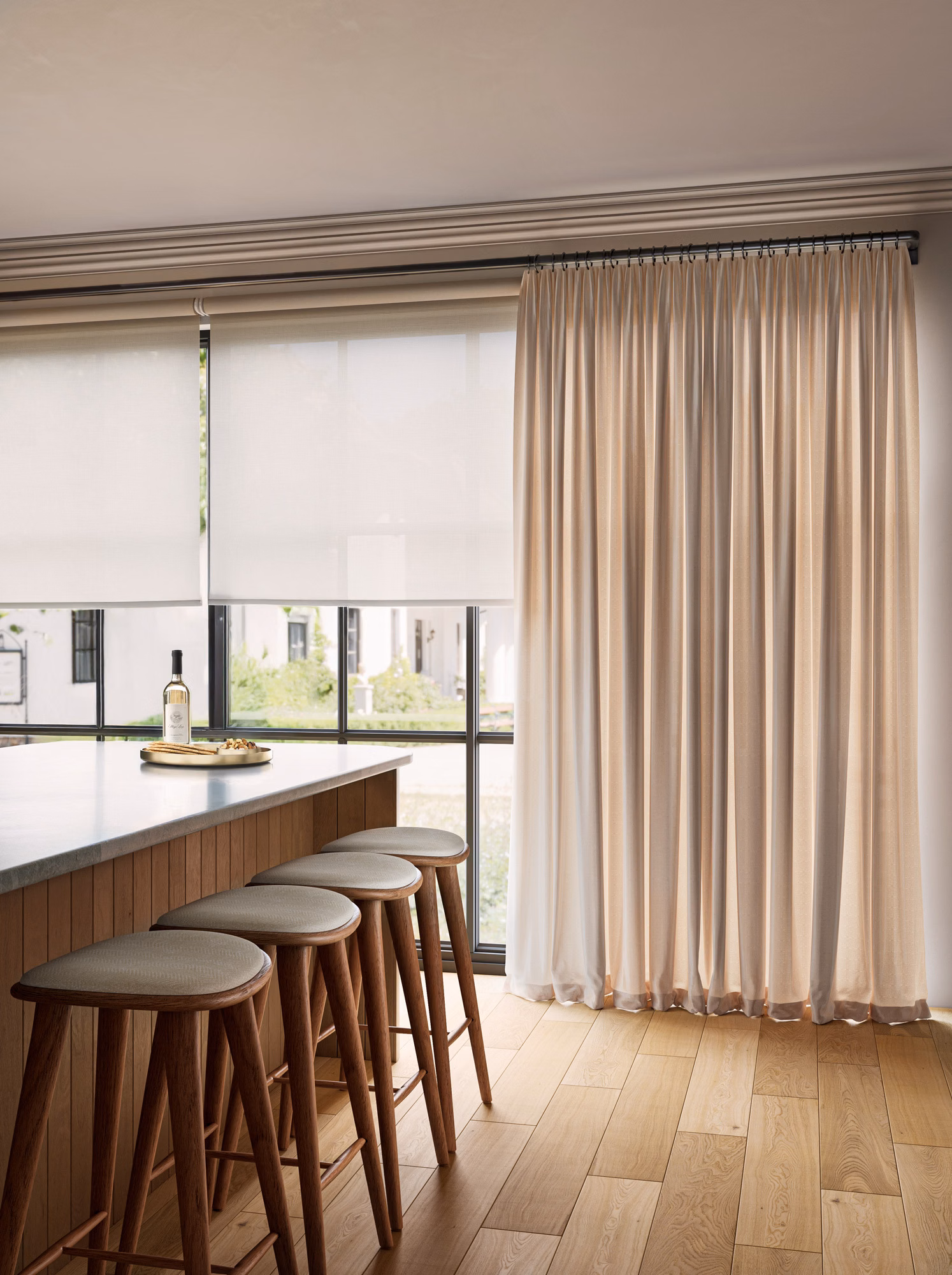 Light filtering roller shades with Westchester silk drapes and a curved French return rod